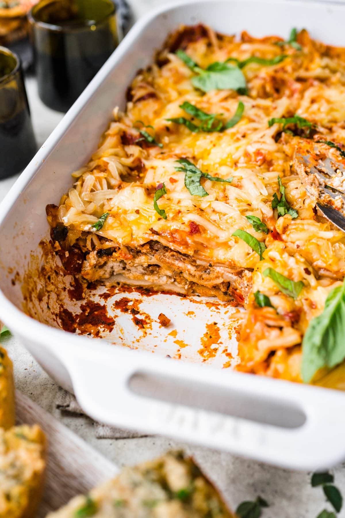 side view of vegan lasagna in a pan.