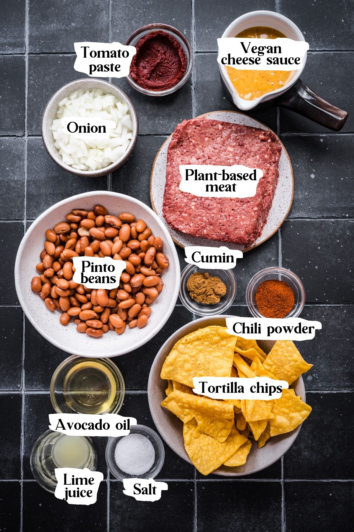 Overhead view of vegan nacho ingredients, including beans and plant-based meat.