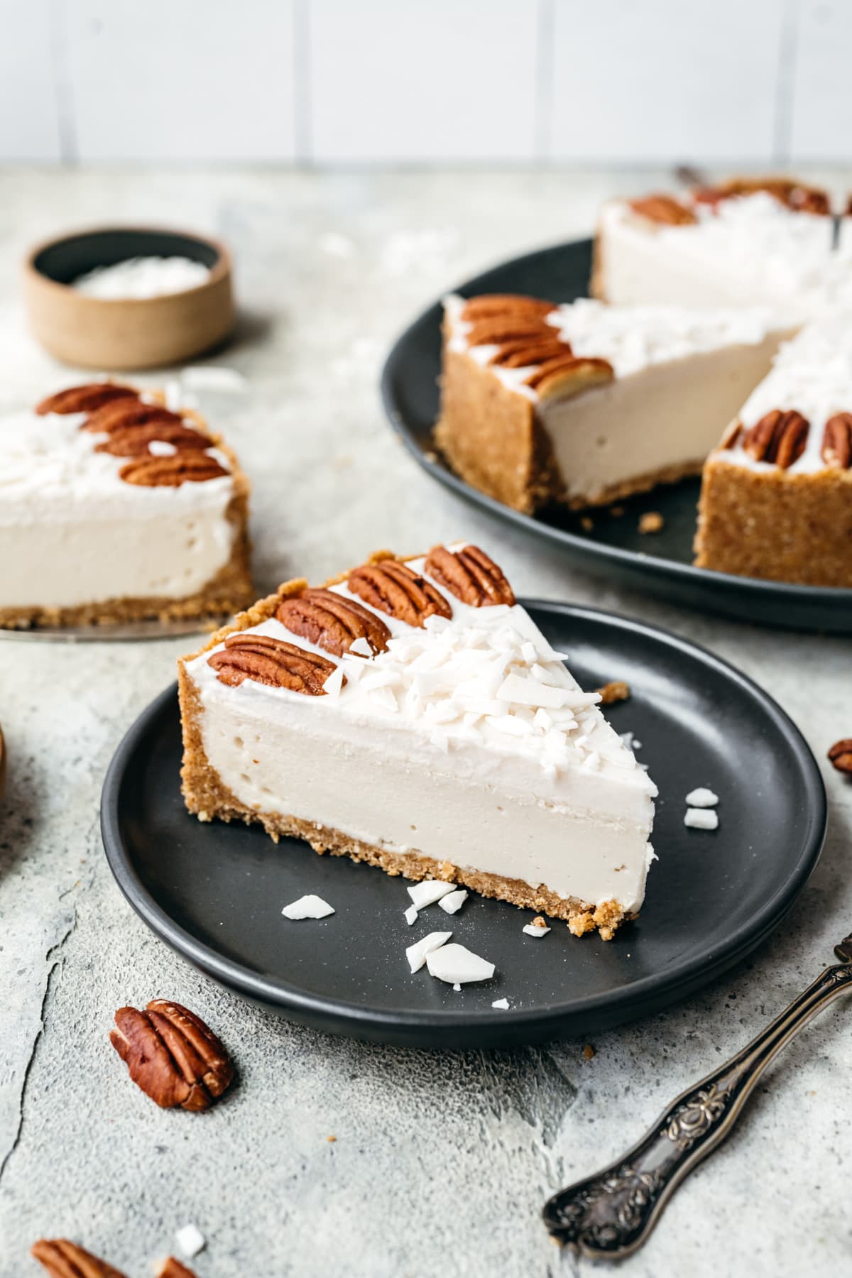 Front view of white chocolate cheesecake on a plate.