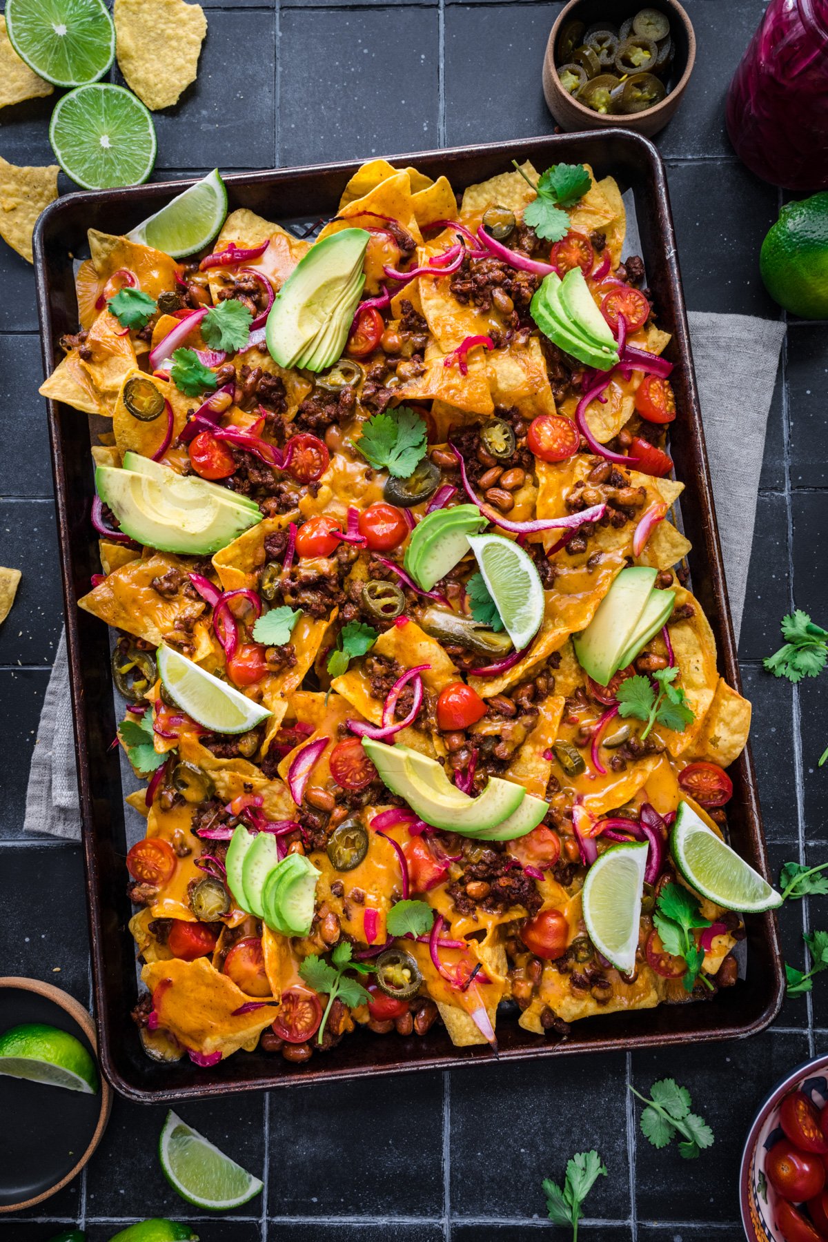 Overhead view of vegan nachos on a tray.