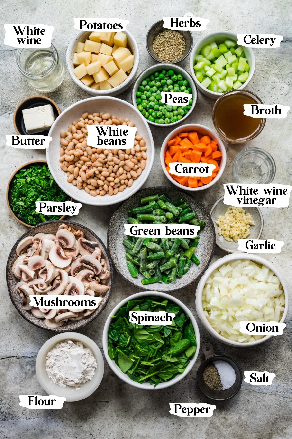 Overhead view of vegan pot pie ingredients, including white beans, peas, and potatoes.