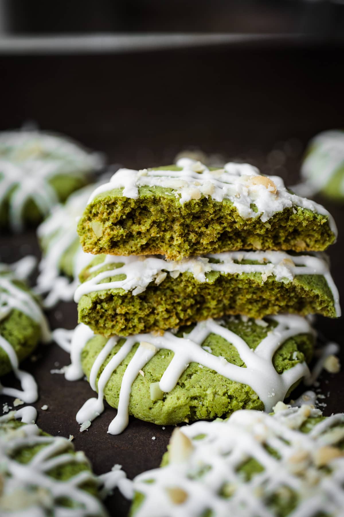 Stack of vegan matcha cookies showing interior of cookie.