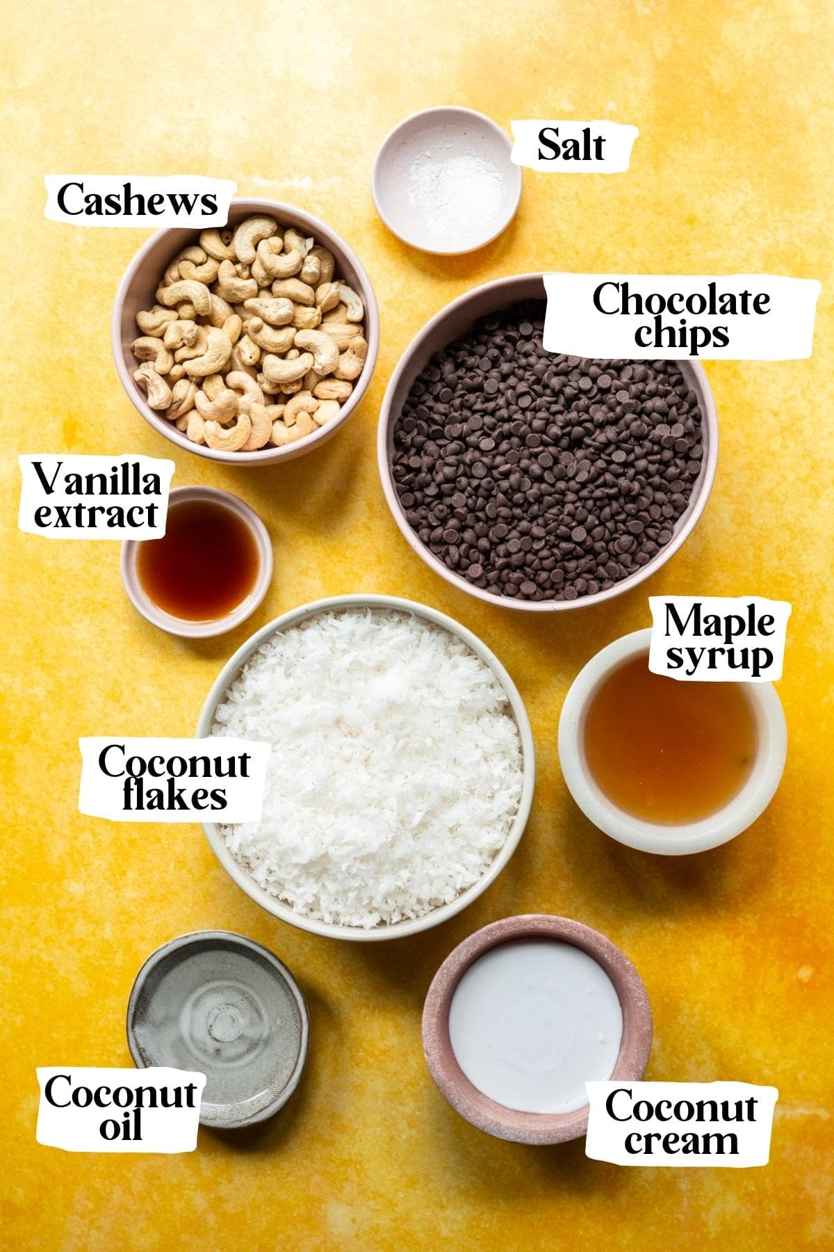 overhead view of ingredients for coconut easter eggs in small prep bowls. 