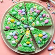 Overhead view of vegan no bake easter egg cheesecake sliced on plate.