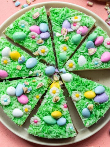 Overhead view of vegan no bake easter egg cheesecake sliced on plate.