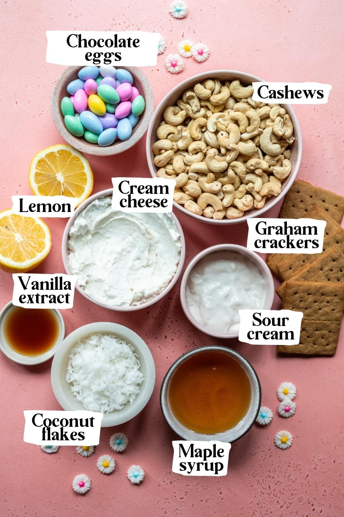 Overhead view of ingredients for vegan easter egg cheesecake in small prep bowls with text labels. 