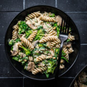 Overhead view of hummus pasta with veggies.