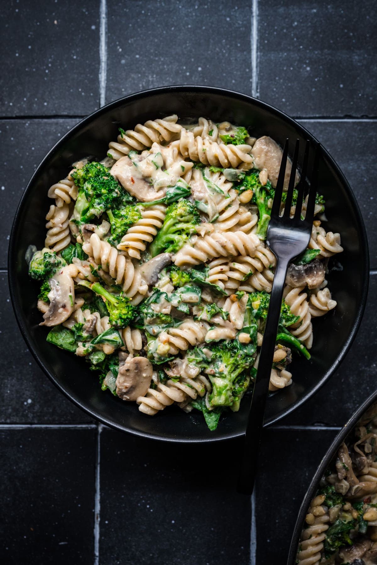 Overhead view of hummus pasta in a bowl.