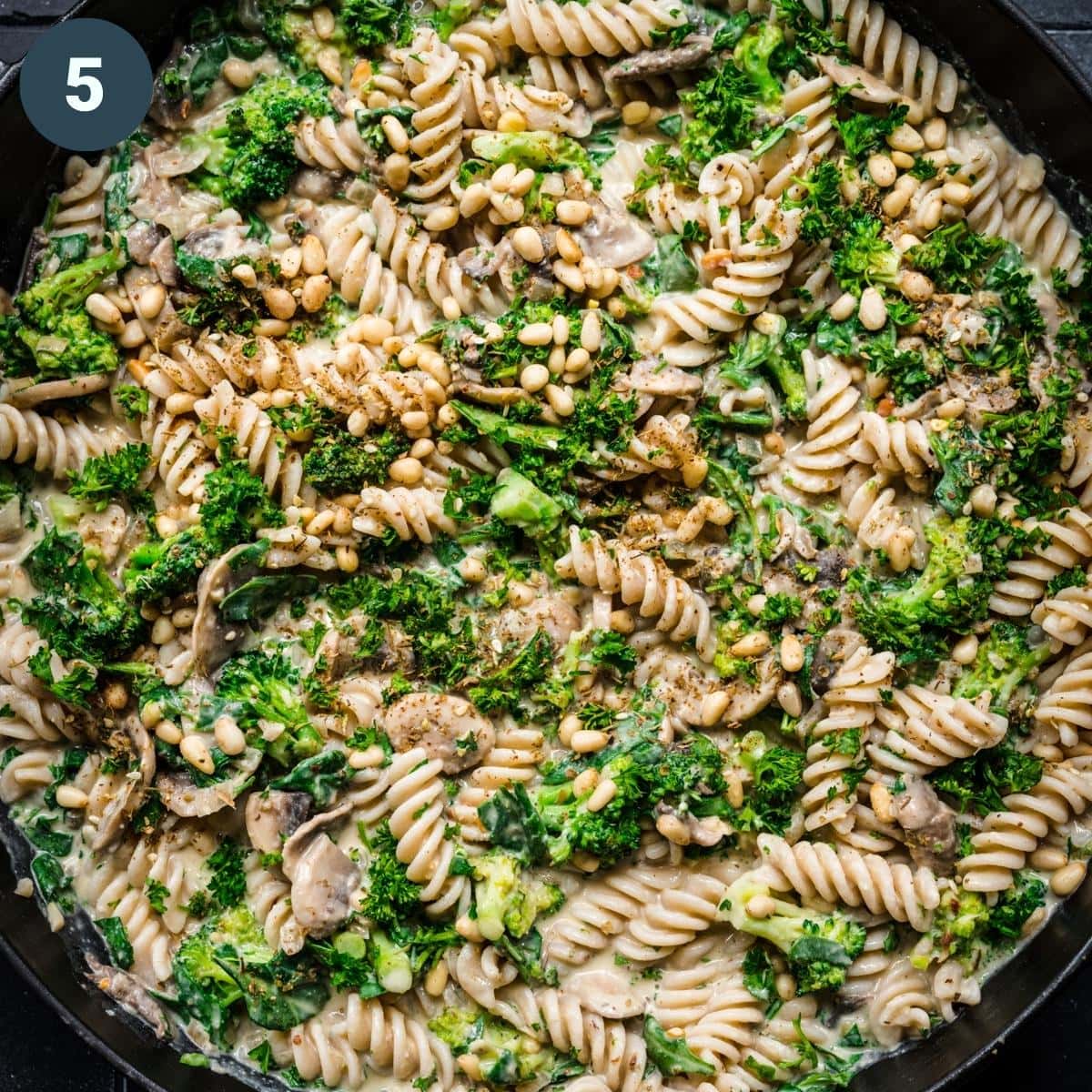 overhead view of of hummus pasta in pan. 