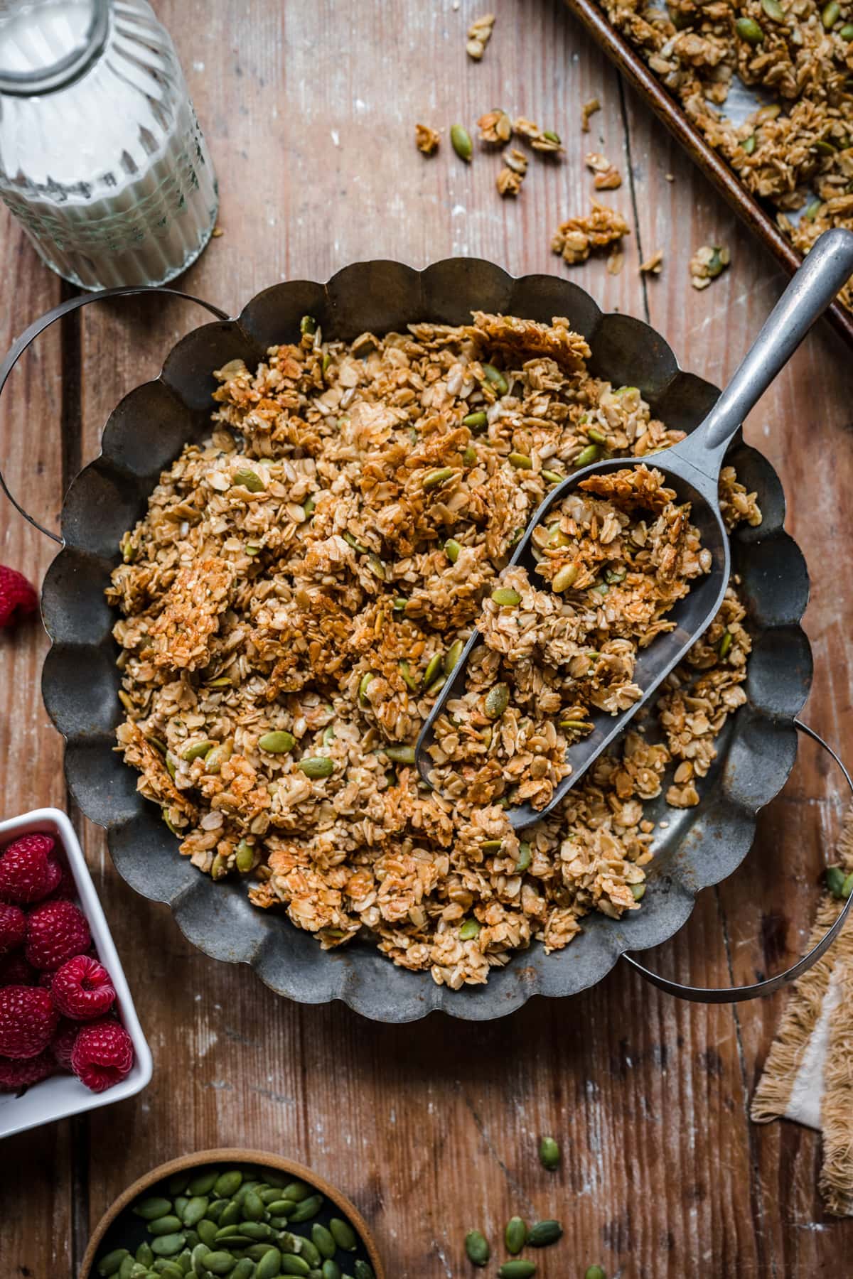 Overhead view of nut free granola with a scooper resting on top.