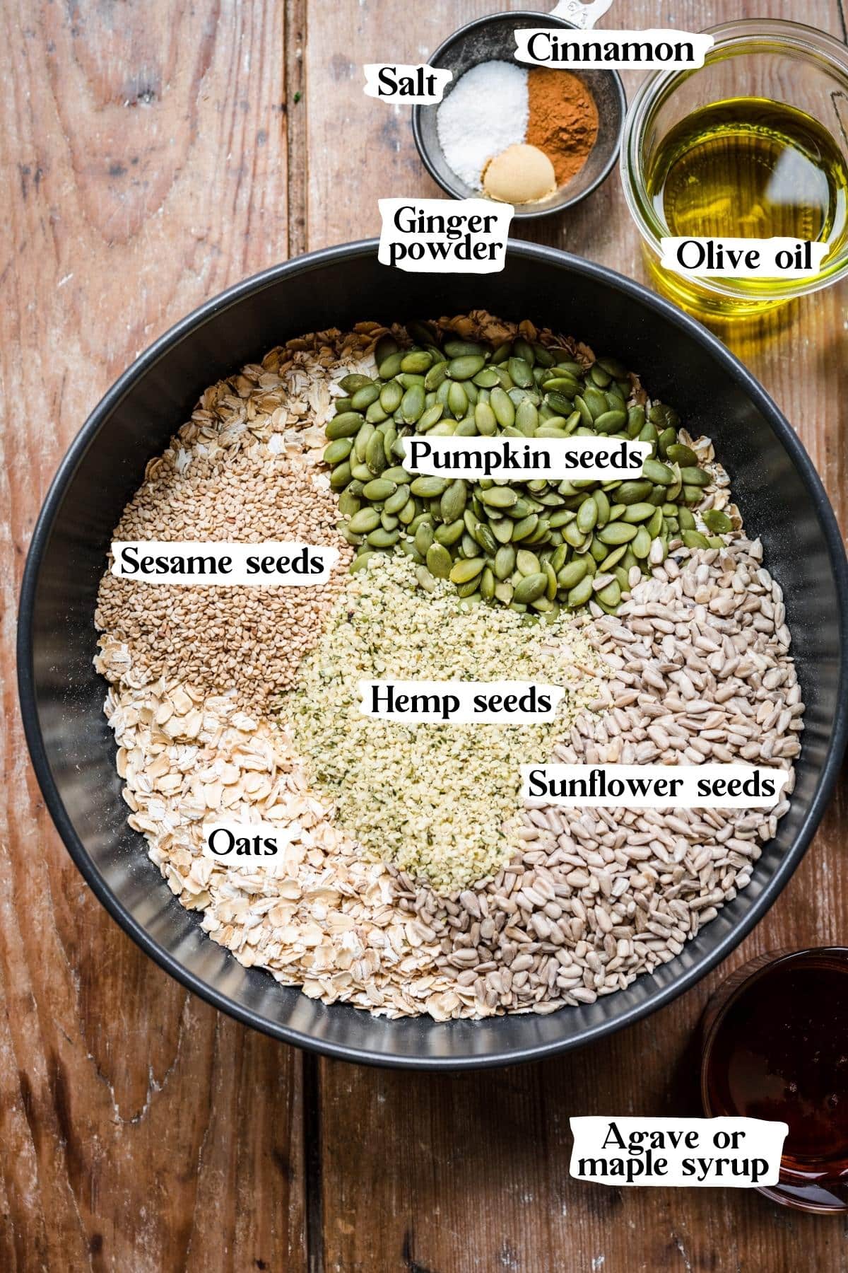 Overhead view of nut free granola ingredients, including sunflower seeds and oats.