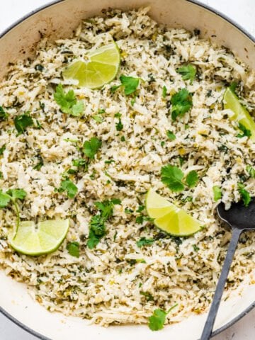 Close up of cilantro lime cauliflower rice in a pan.