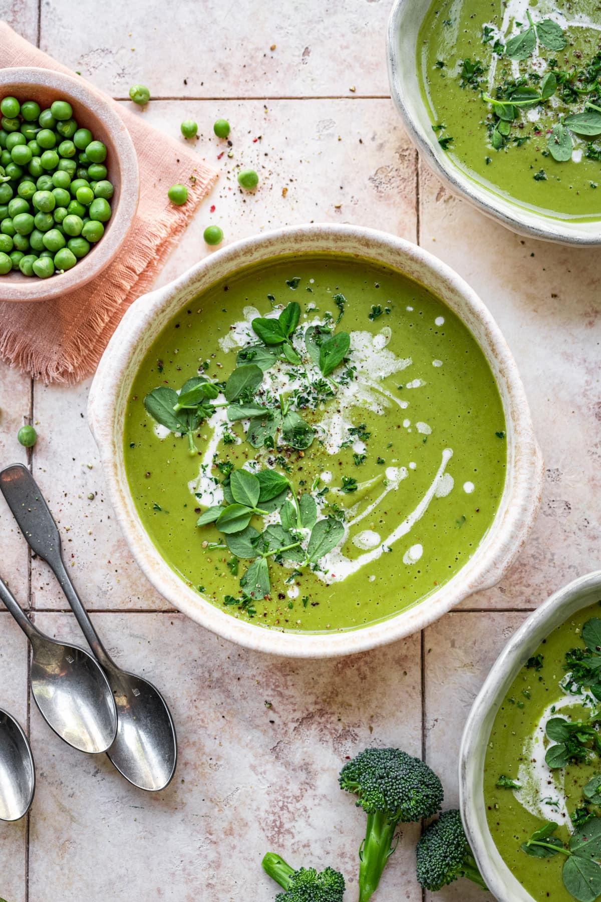 Overhead view of soup with microgreens and yogurt.