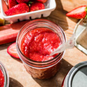 Overhead view of strawberry rhubarb jam in a jar.