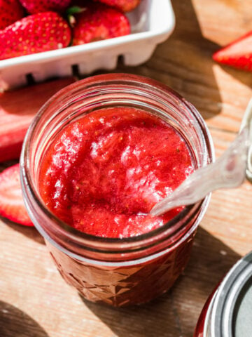 Overhead view of strawberry rhubarb jam in a jar.