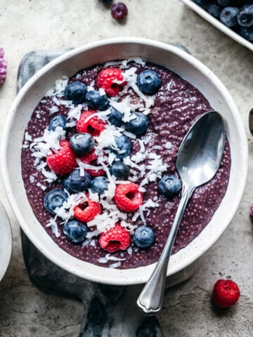 Overhead view of blueberry chia pudding with fruit on top.