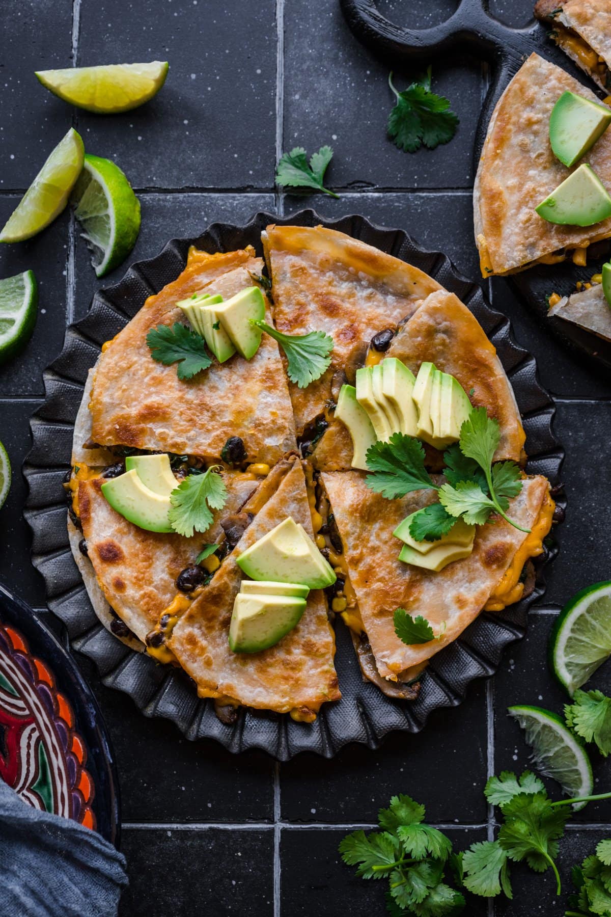 Overhead view of vegan quesadilla sliced into pieces.