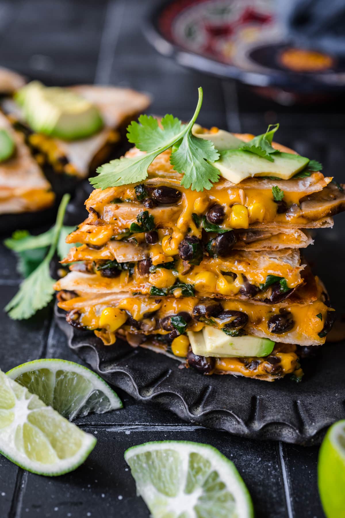 Front view of vegan quesadillas garnished with cilantro.