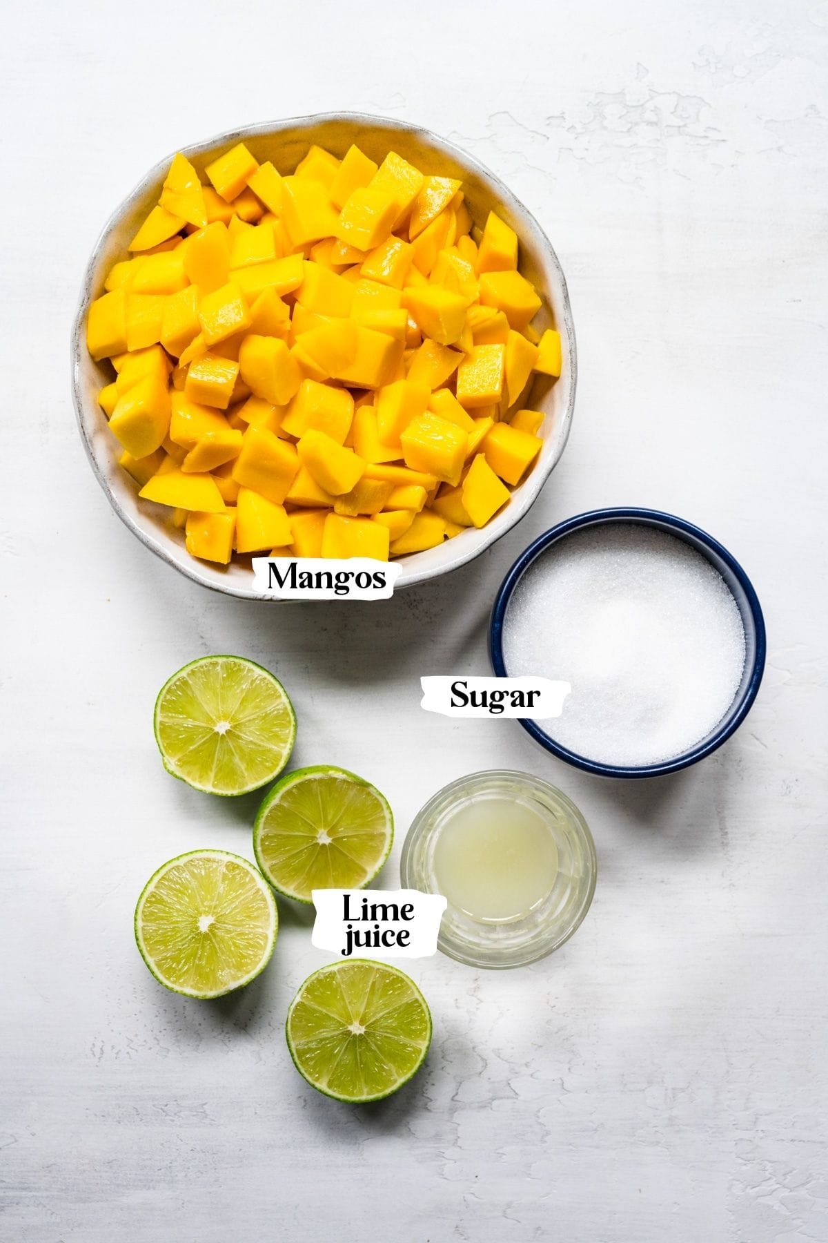 Mango jam ingredients including mangos, sugar and lime juice.