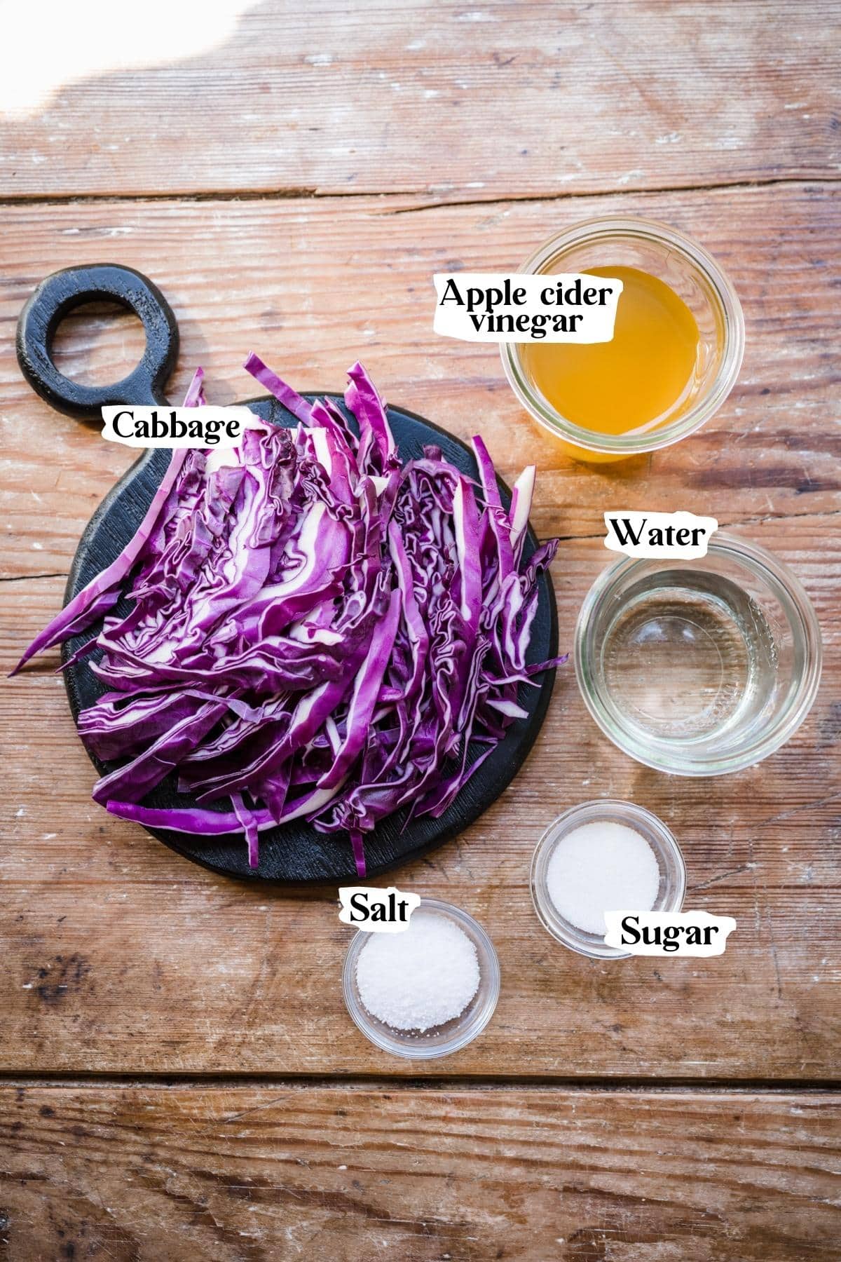 Pickled cabbage ingredients, including cabbage and apple cider vinegar.
