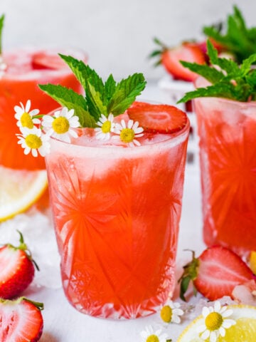 Close up of finished strawberry mocktails with garnish.