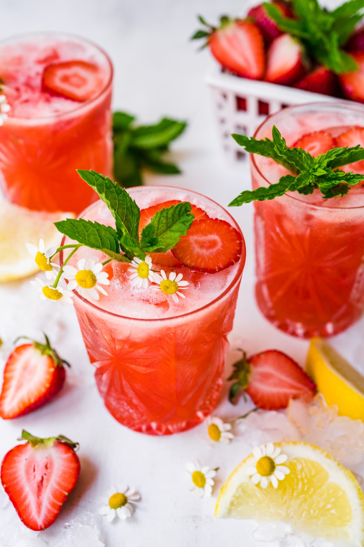 Overhead view of finished mocktails with garnish.