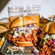Pulled jackfruit burger on a metal tray.