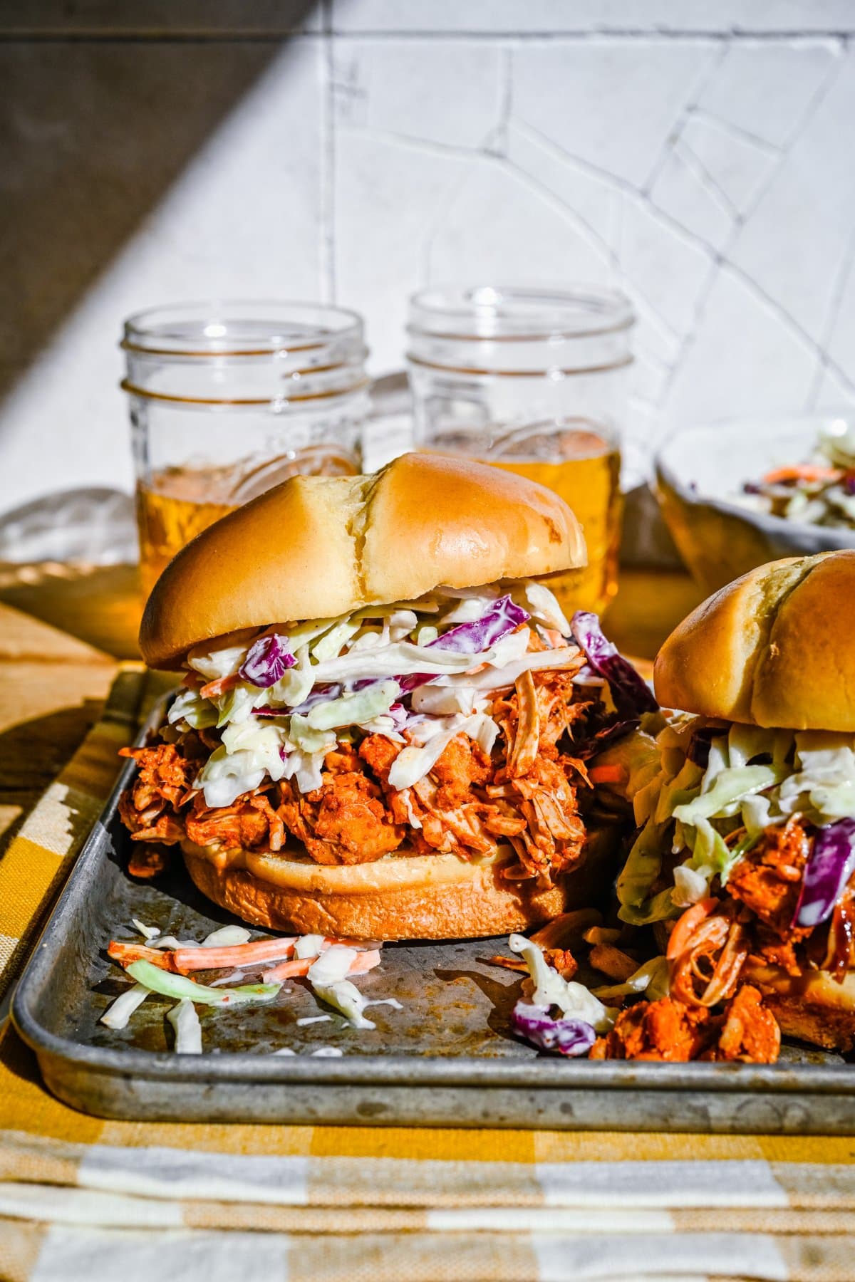 Pulled jackfruit burger on a metal tray.