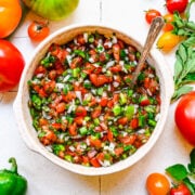 Close up of finished tomato relish in white bowl.