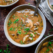 Close up of finished cream of mushroom soup served in a bowl.