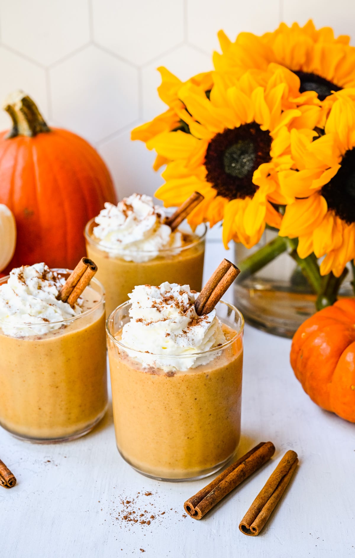 Finished pumpkin pie smoothies with sunflowers in back.