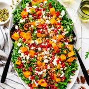 Overhead of finished pumpkin salad on a oval platter.