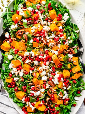 Overhead of finished pumpkin salad on a oval platter.