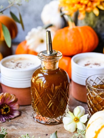 Close up of finished pumpkin spice simple syrup in a bottle.