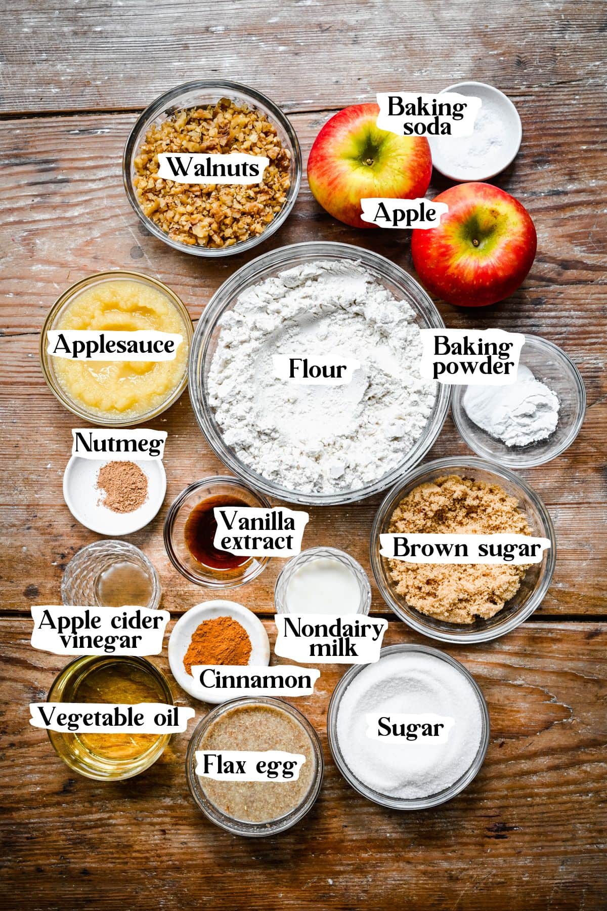 Overhead view of vegan apple muffins, including flour, applesauce, and sugar.