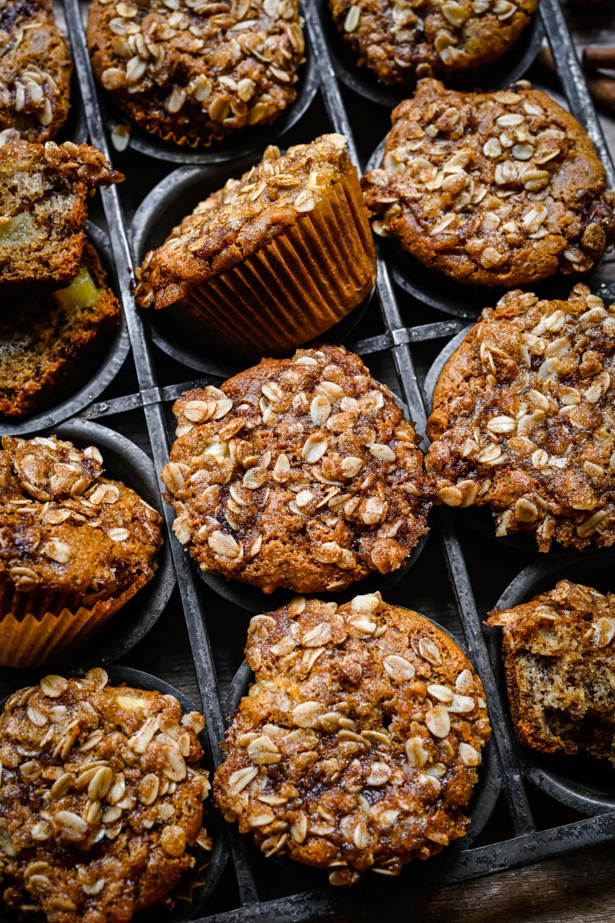 Overhead view of vegan apple muffins in a tin.