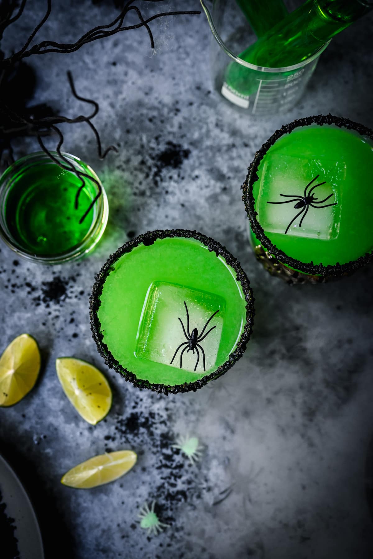 Overhead view of poison apple green cocktail in cocktail glass.