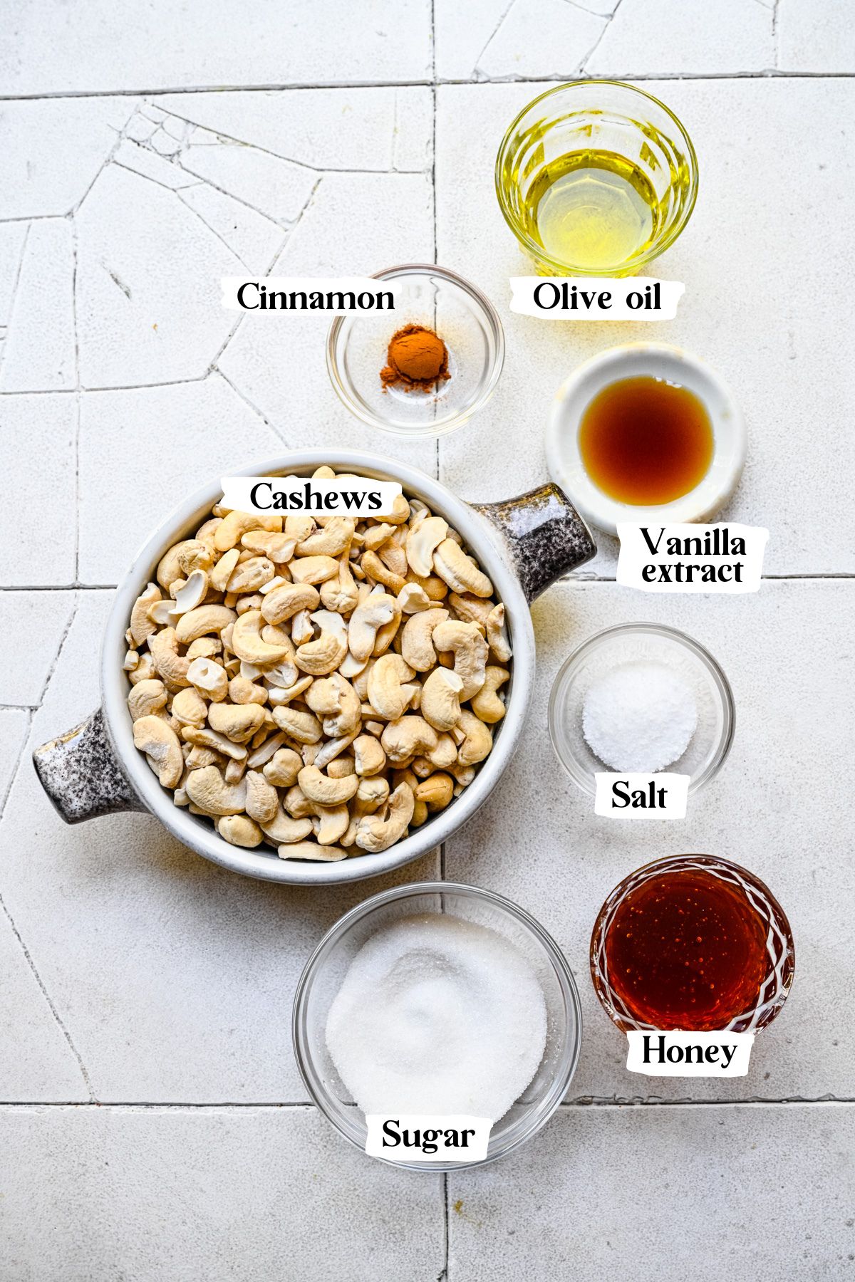 Overhead of honey roasted cashews including cashews and cinnamon.