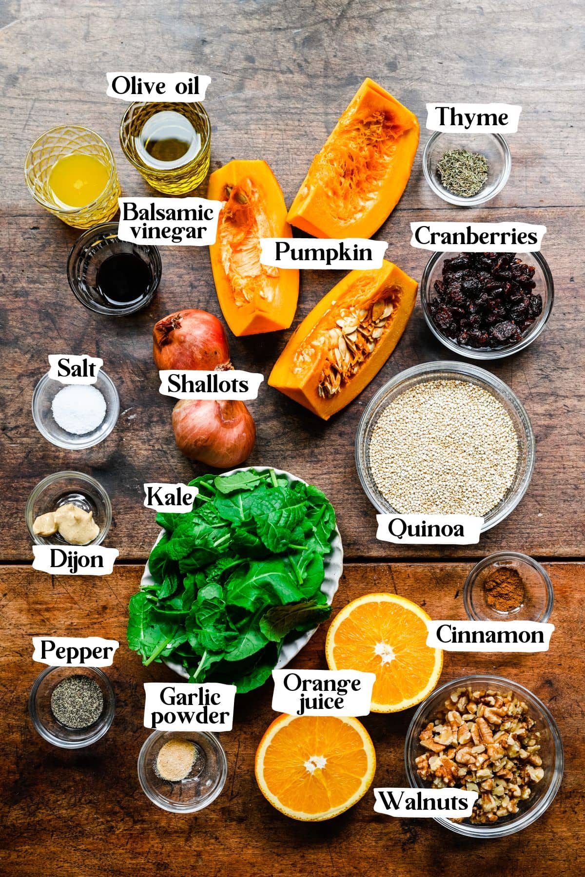 Pumpkin salad ingredients including quinoa, kale, and shallots.
