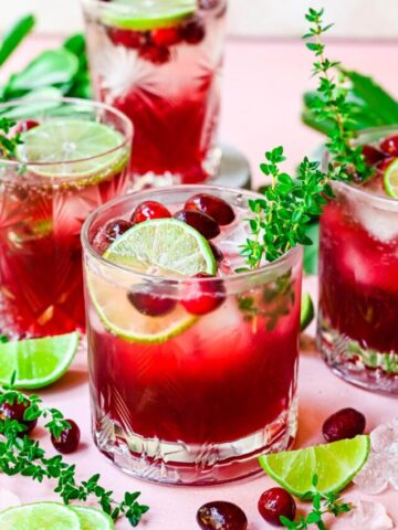 Close up of finished cranberry gin cocktails with garnish.