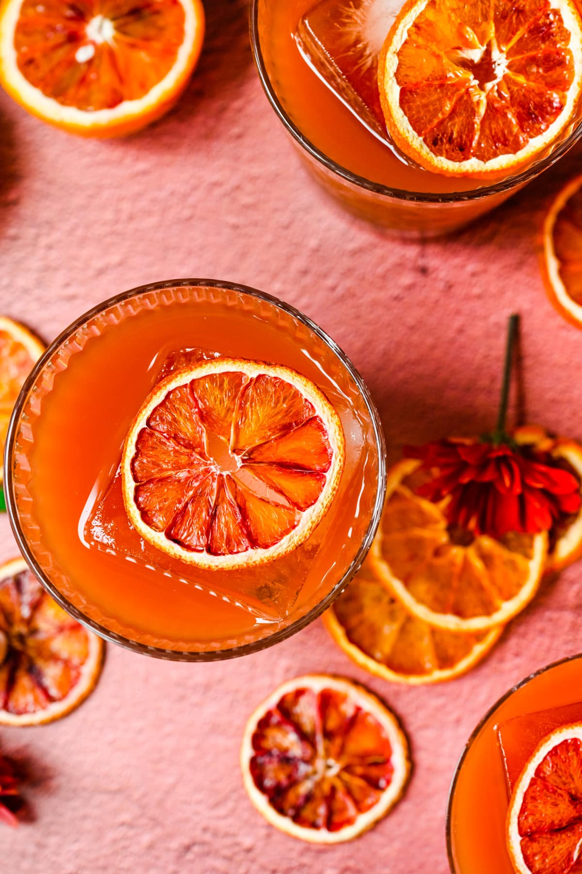 Overhead of the finished blood orange old fashioned cocktails.