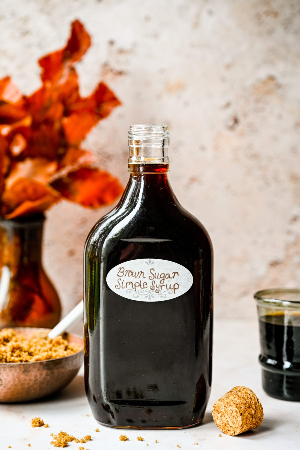 Brown sugar simple syrup in a glass bottle.