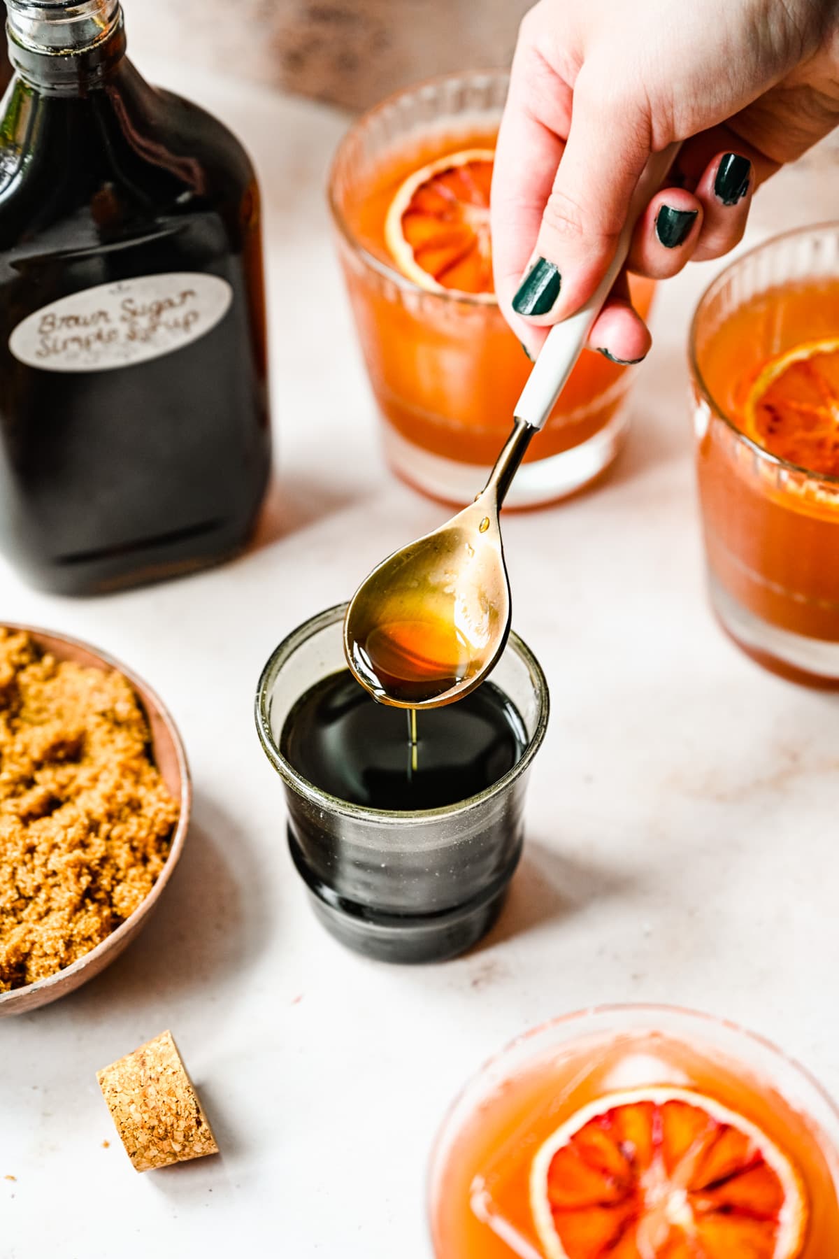 Finished brown sugar simple syrup in a spoon.