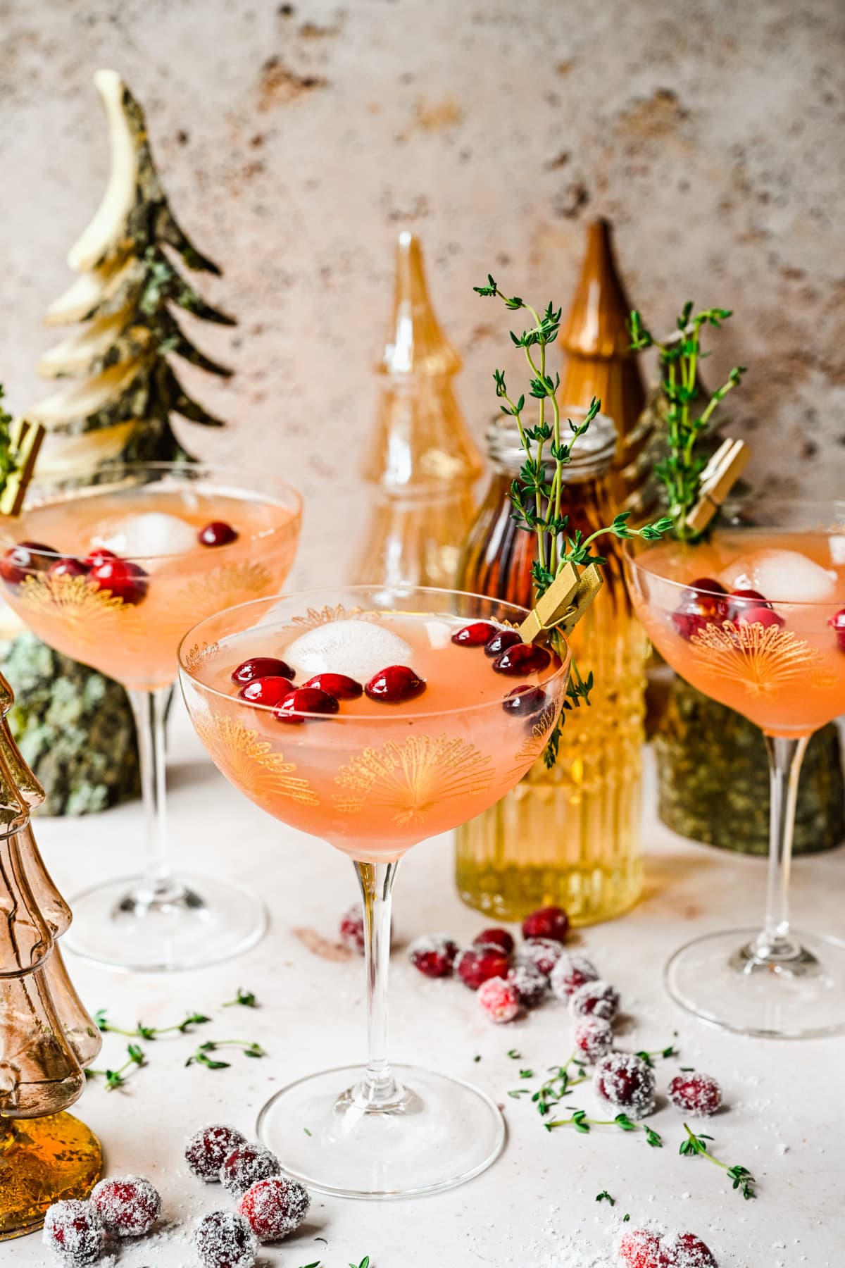 Front view of the finished mocktails in glasses with trees in back.