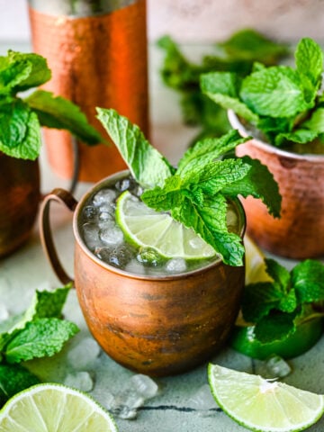 Front view of kentucky mule with lime and mint garnish.