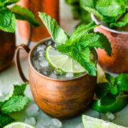 Front view of kentucky mule with lime and mint garnish.