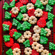 Overhead of the finished vegan spritz cookies on a baking rack.