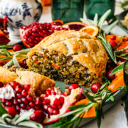 Finished vegan wellington on a fruit filled platter.