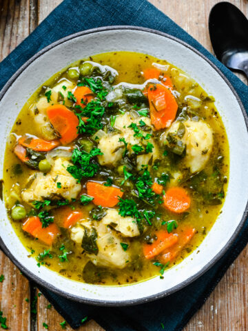 Close up of the finished vegetable dumpling soup in a bowl.