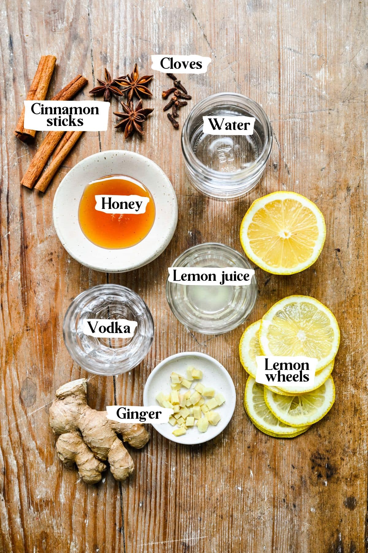 Hot toddy ingredients including lemon juice and ginger.